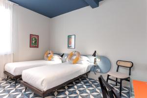 Postel nebo postele na pokoji v ubytování Riva Rooms