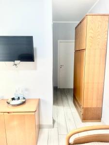 TV a/nebo společenská místnost v ubytování Afficamere Mattia Mottola 1
