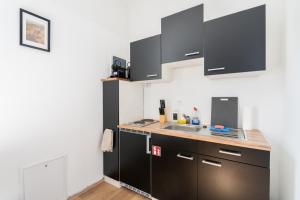 Kuchyň nebo kuchyňský kout v ubytování FarawayHomes Studios 43