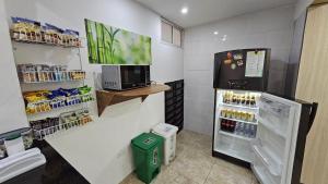 a kitchen with an open refrigerator in a store at Casa vacacional Estadía Primaveral in Fusagasuga