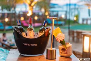 a basket of wine bottles on a table at Athenia Hoi An Boutique Hotel & Spa in Hoi An