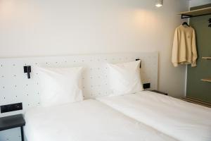 All Suites Appart Hôtel et Hôtel - Paris 13 - Porte d'Italie客房内的一张或多张床位