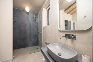 a bathroom with a sink and a shower at Villa Margarita in Katelios +31 photos