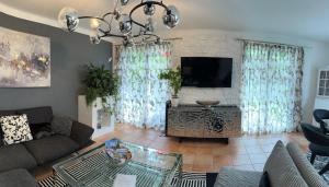 Posezení v ubytování Wohnung 5 mit Garten und sonniger Terrasse