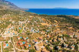 an aerial view of a resort near the ocean at Villa Thalia Katerina in Mousata