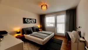 Posteľ alebo postele v izbe v ubytovaní Apartment Budweis 2kk České Budějovice