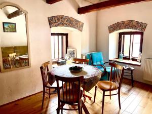 a dining room with a table and chairs at Villa Lilly in Banská Štiavnica