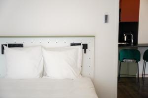All Suites Appart Hôtel et Hôtel - Paris 13 - Porte d'Italie客房内的一张或多张床位