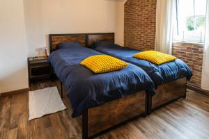 Postel nebo postele na pokoji v ubytování Gîte La Maison Jaune