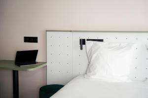 All Suites Appart Hôtel et Hôtel - Paris 13 - Porte d'Italie客房内的一张或多张床位