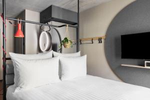Stay KooooK Leipzig City - Online Check In客房内的一张或多张床位