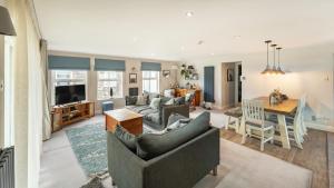a living room with a couch and a table at Derwentwater View in Portinscale