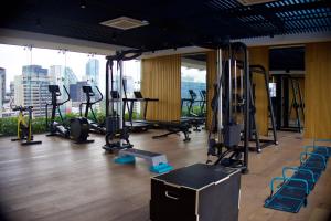 a gym with treadmills and exercise equipment in a building at Luxury Apartment in Roma Norte With Stunning Views in Mexico City