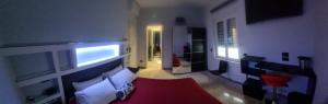 a view of a living room with a television in a room at Max Guest House in Praia a Mare