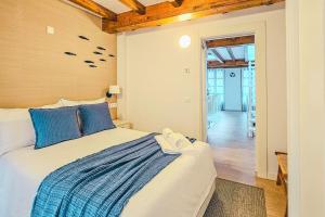 En eller flere senge i et værelse på Casa del Puerto