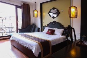 Postel nebo postele na pokoji v ubytování Art Hotel Ha Noi