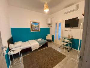 TV a/nebo společenská místnost v ubytování Maison Sarraj