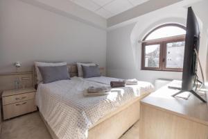 Letto o letti in una camera di City SMART