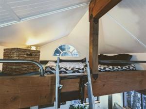 two bunk beds in a room with a window at Bluebird Day - River Gem Bungalow in Bend