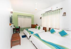 Letto o letti in una camera di The Panorama Negombo