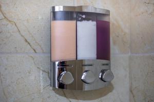 a paper towel dispenser hanging on a wall at Bright 1BR Apt with Niagara Falls and Scenic Stay in Niagara Falls