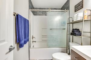 a bathroom with a shower and a toilet at Boise Home with Hot Tub, Yard about 5 Mi to Dtwn! in Boise +27 photos
