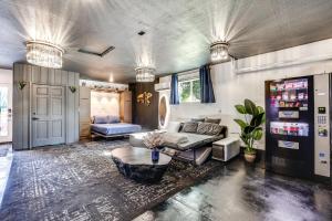 a living room with a couch and a table at Boise Home with Hot Tub, Yard about 5 Mi to Dtwn! in Boise