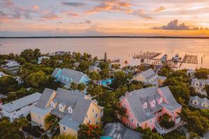 an aerial view of a house on the water with a dock at Valentines Resort & Marina in Harbour Island +108 photos