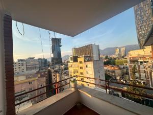 a balcony with a view of a city at Elois Center Apartament in Tirana