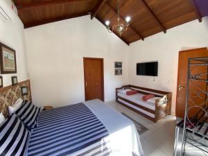Postel nebo postele na pokoji v ubytování Casarão Coimbra Pousada Colonial + 37 fotografií