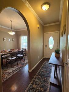 a dining room with a dining table and a dining roomiasm at 4 bedroom pet friendly grill under 5 min to airport and Choctaw Casino in Calera