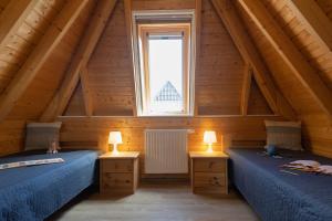 Ένα ή περισσότερα κρεβάτια σε δωμάτιο στο Ferienhaus Mellumplate 62