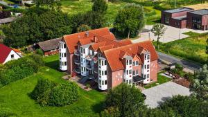 an aerial view of a house with an orange roof at Appartement Cappel Whg 3 in Cappel-Neufeld +15 photos