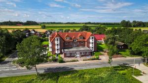 an aerial view of a large house with a street at Appartement Cappel Whg 23 in Cappel-Neufeld