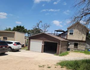 a house with a garage in a driveway at Stylish Garage Apartment by Reese Creek in Killeen +4 photos