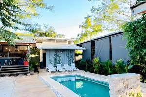 an image of a house with a swimming pool at Nirvana Beach Home in Paraíso
