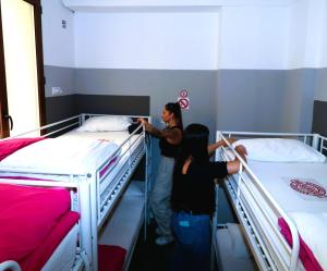 A bed or beds in a room at Madrid Downtown Hostel