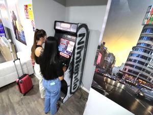 A television and/or entertainment centre at Madrid Downtown Hostel