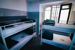 A bed or beds in a room at Madrid Downtown Hostel