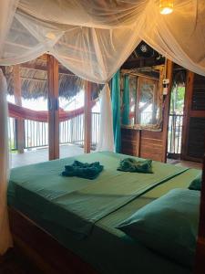 Postel nebo postele na pokoji v ubytování Coco Lodge & Surf, vista al mar + 26 fotografií