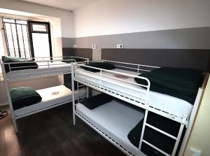 A bed or beds in a room at Madrid Downtown Hostel