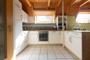 Η κουζίνα ή μικρή κουζίνα στο Ferienhaus Knechtsand 34 +31 φωτογραφίες