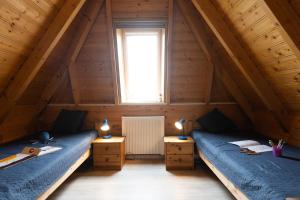 Postel nebo postele na pokoji v ubytování Ferienhaus "Nordsee Felber" Mellumplate 40