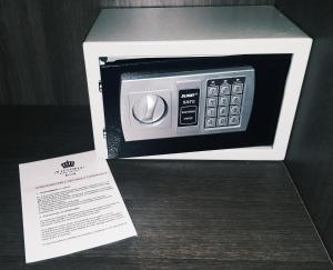 a microwave in a white box with a card in it at VITTORIA ROOMS GuestHouse - the Original since 2015 in Genoa +38 photos