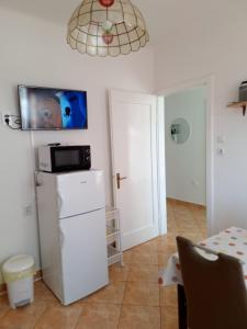 Kuchyň nebo kuchyňský kout v ubytování Apartment Banjol 137