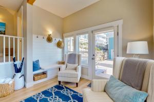 a living room with a couch and a chair at Pacific Breeze in Lincoln City