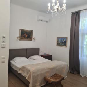 Postel nebo postele na pokoji v ubytování Villa Musik - apartments in historical Villa , Baden