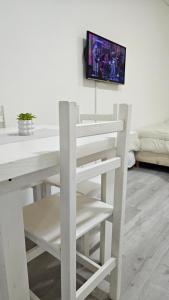 TV a/nebo společenská místnost v ubytování Departamento en Microcentro a pasos del Obelisco