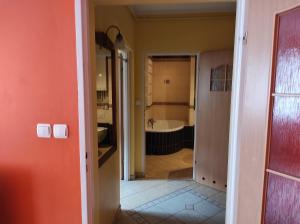 a view of a bathroom with a tub and a sink at Swineminde Polen Apartament Haffen blick bitte anrufen in Ahlbeck
