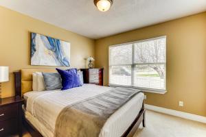 a bedroom with a large bed and a window at Sprawling Utah Mansion with Private Hot Tub and Sauna in Draper